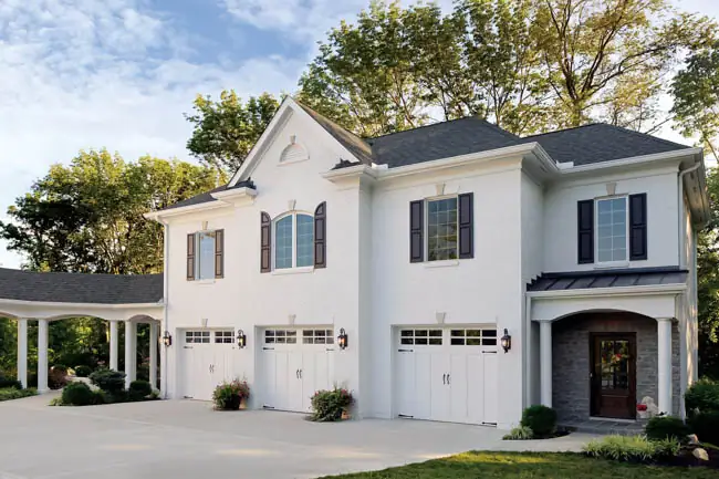 Coachman Collection - Steel Insulated with Composite Overlay garage door by Clopay