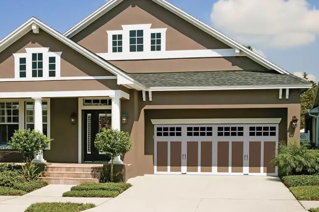Coachman Collection - Steel Insulated with Composite Overlay garage door by Clopay