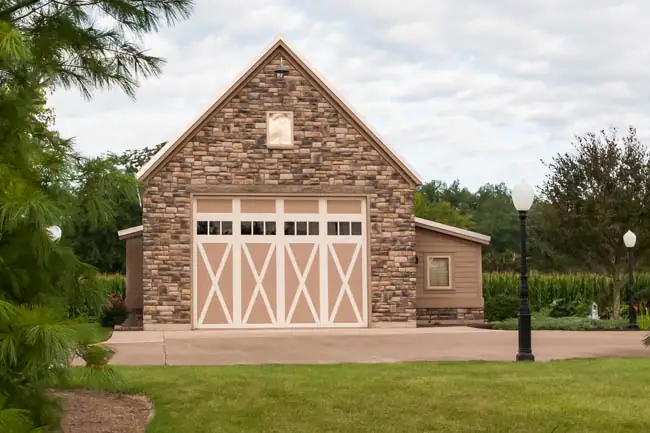 Coachman Collection - Steel Insulated with Composite Overlay garage door by Clopay