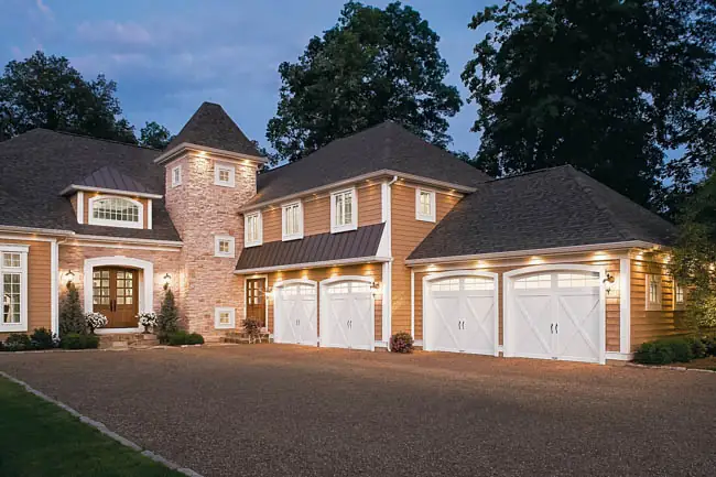 Coachman Collection - Steel Insulated with Composite Overlay garage door by Clopay