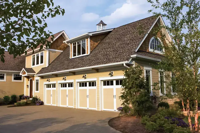 Coachman Collection - Steel Insulated with Composite Overlay garage door by Clopay