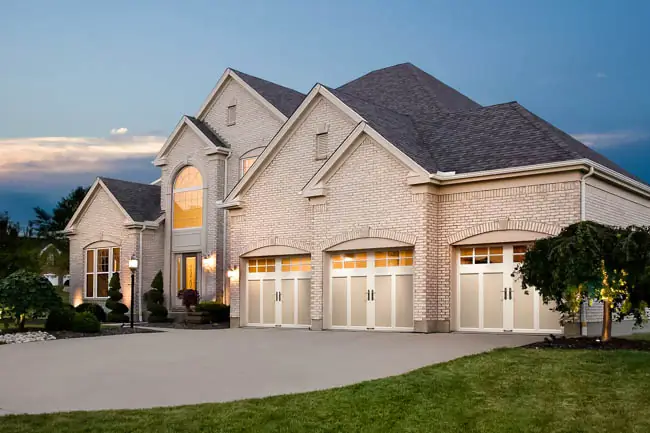 Coachman Collection - Steel Insulated with Composite Overlay garage door by Clopay